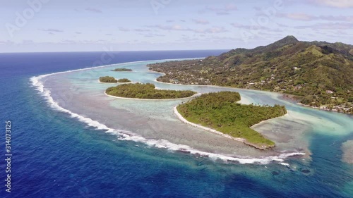 Stationary aerial view of the stunning Muri lagoon in the Rarotonga island in the Cook islands in south Pacific on a sunny day