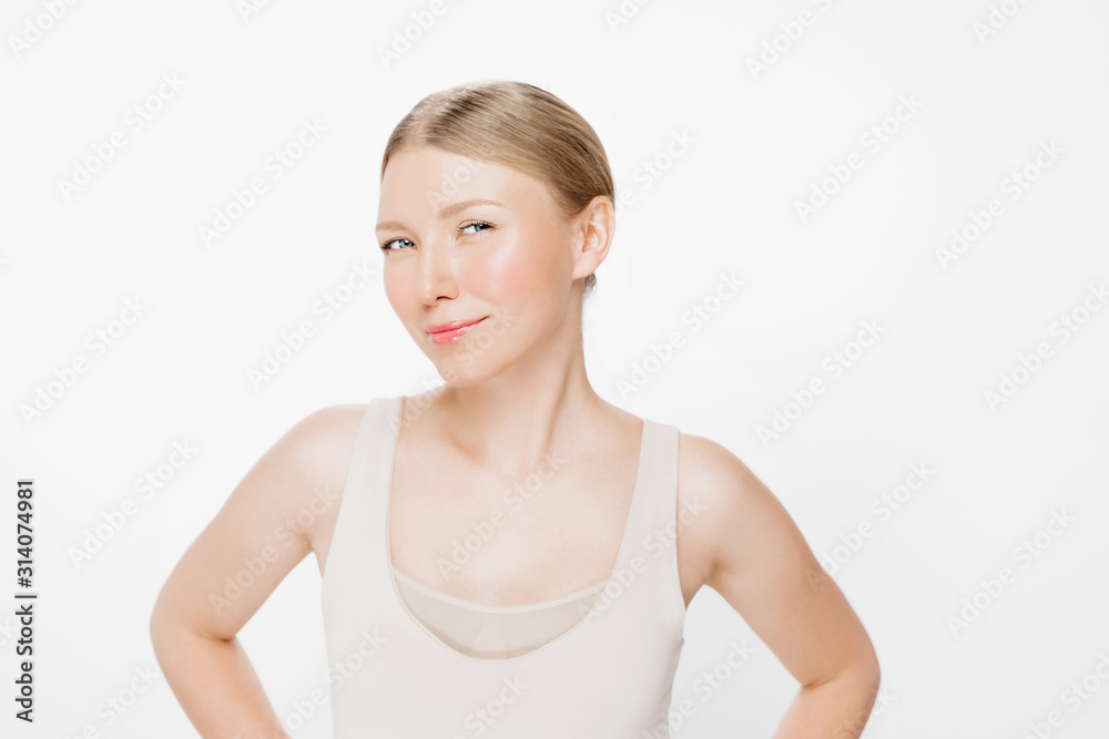 Portrait of a pretty young blond woman posing isolated over white wall background. Beautiful woman beauty health care. Beauty and spa. Perfect fresh skin. Portrait of a pretty young blond woman posing isolated over white wall background. Beautiful woman beauty health care. Beauty and spa. Perfect fresh skin.