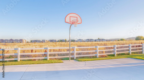 Panorama Empty all weather exterior basketball court on a sunny day