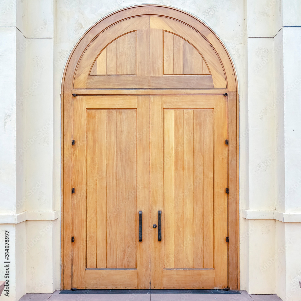 Square frame Double arched wooden entrance door of exterior