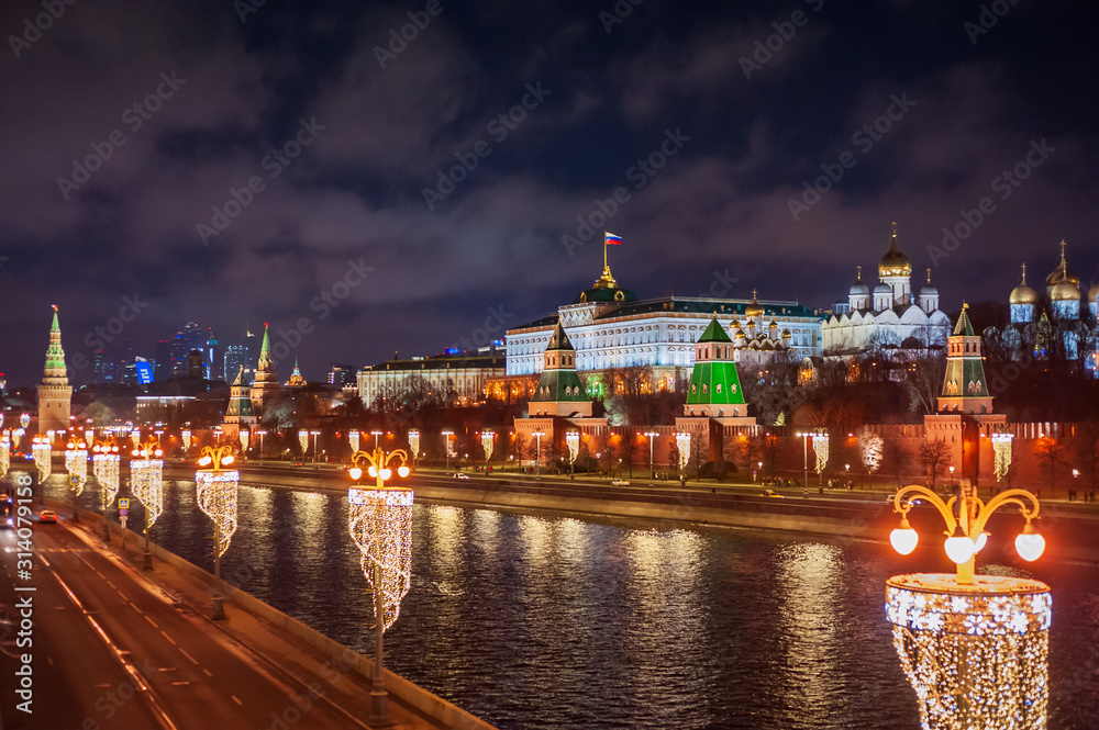 Moscow, Russia - January 03, 2020: View of the Moscow Kremlin, Moscow river and Kremlin embankment at the Christmas illuminations at night.