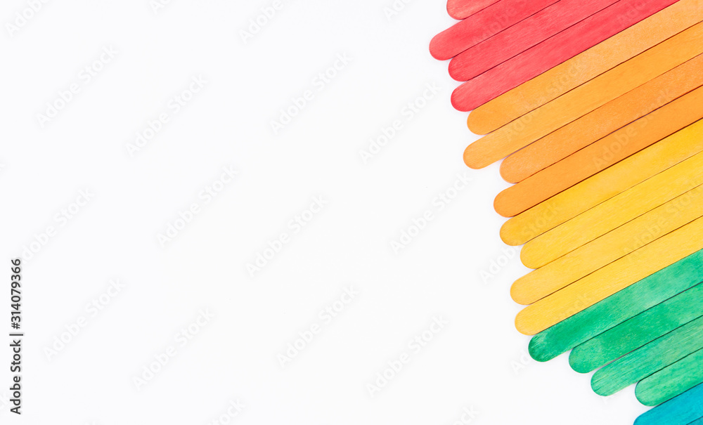 Premium Photo  Colorful rainbow wooden popsicles on white paper