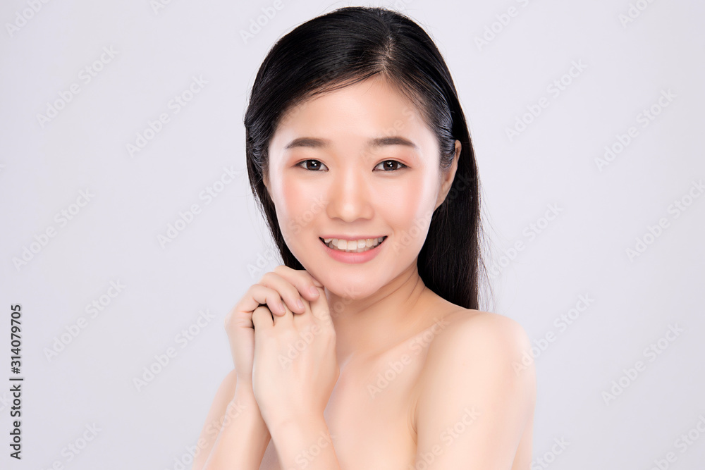 Beautiful Young Asian Woman with Clean Fresh Skin. Face care, Facial treatment, on light grey background, Beauty and Cosmetics Concept Beautiful Young Asian Woman with Clean Fresh Skin. Face care, Facial treatment, on light grey background, Beauty and Cosmetics Concept