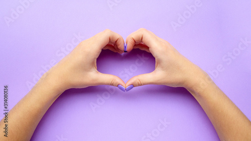 Girl holding hands with heart. Stylish trendy