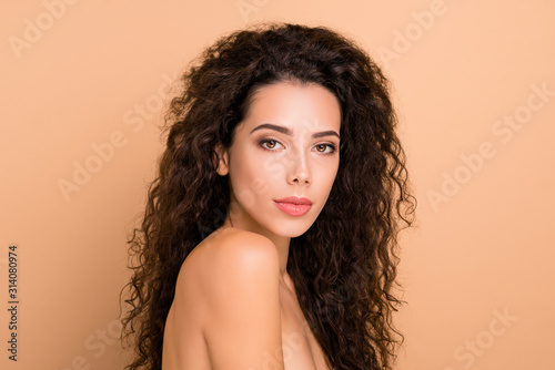 Close up side profile photo beautiful amazing she her lady healthy brown curls ideal brilliant appearance plump allure tempting big lips balm wear no clothes isolated beige pastel background