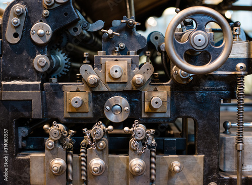 Close-up view of an old printing machine