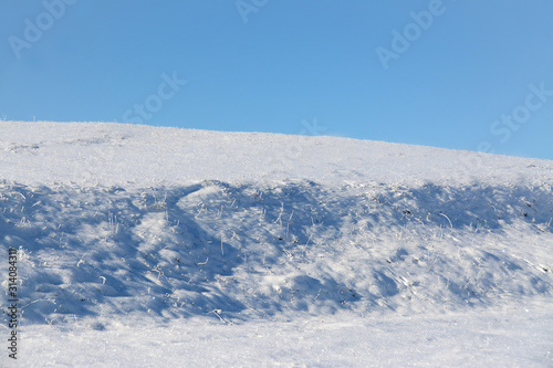 a ground bump covered with snow