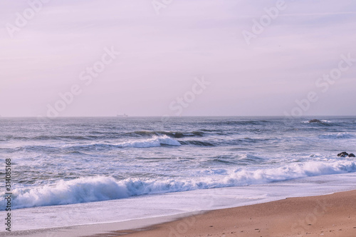 Purple waves washed Beach Lighthouse as a Landmark