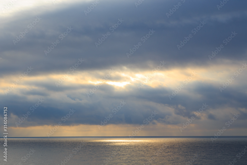 Bright cumulus clouds against the blue sky. Sunset sky Natural background. seascape