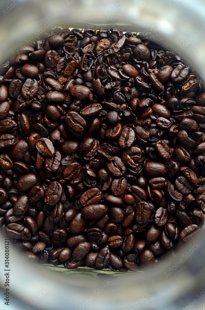 Fototapeta premium Fresh coffee beans in a glass jar