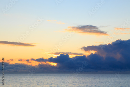 Bright cumulus clouds against the blue sky. Sunset sky Natural background. seascape