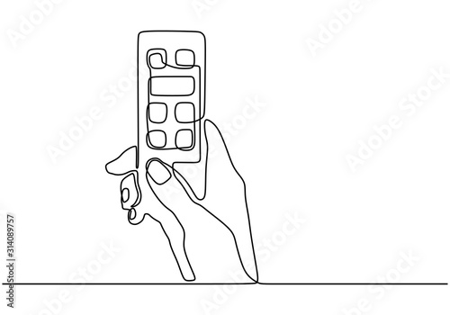 Hand holding remote. Contin...
