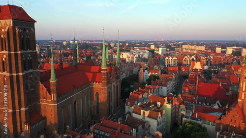 Gdansk, Poland. Aerial 4K reveal video of old city, Motlawa river and famous monuments: Gothic St Mary church, city hall tower, photo