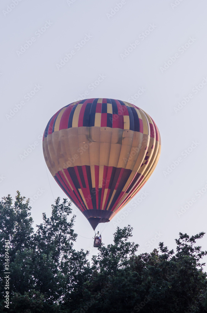 Fototapeta premium hot air balloon is flying at sunrise. romantic balloon flights