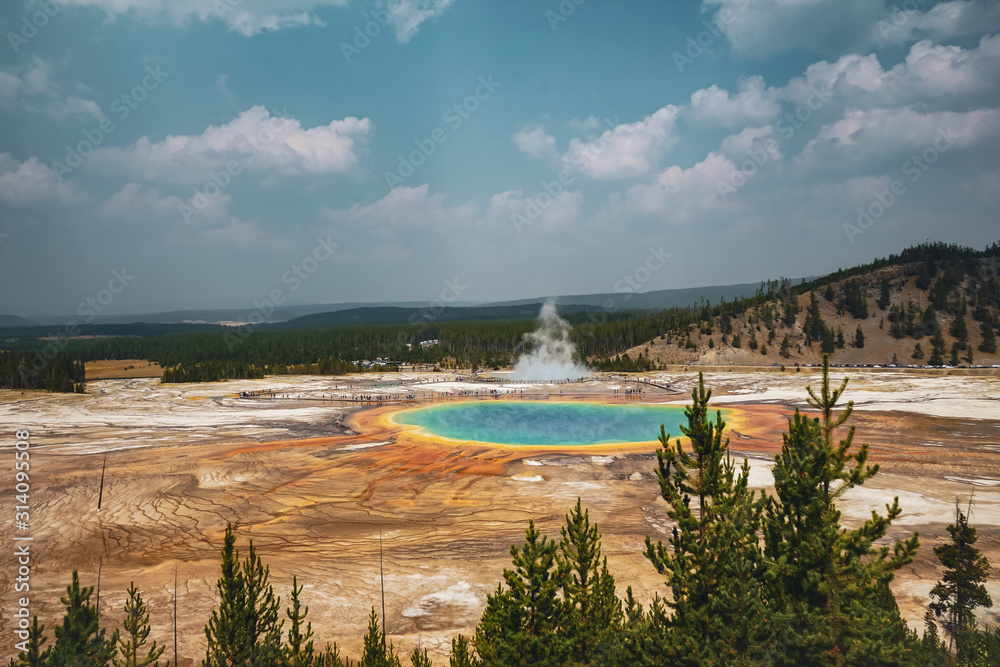 Beautiful bright hot colorful geyser  in mountain area, Grand Spring, Yellowstone