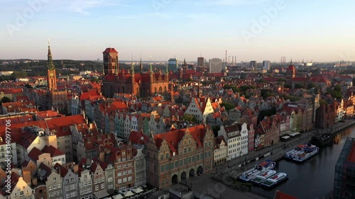 Gdansk, Poland. Aerial 4K reveal video of old city, Motlawa river and famous monuments: Gothic St Mary church, city hall tower, photo