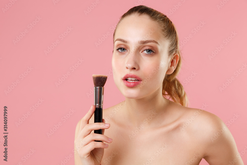 Close up blonde half naked woman 20s perfect skin nude make up blue eyes isolated on pastel pink wall background studio portrait. Skin care healthcare procedures concept. Mock up copy space Brush face Close up blonde half naked woman 20s perfect skin nude make up blue eyes isolated on pastel pink wall background studio portrait. Skin care healthcare procedures concept. Mock up copy space Brush face