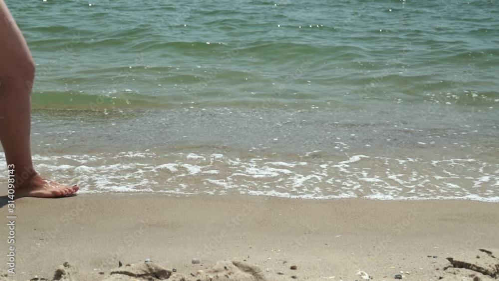 Closeup Of Sea Waves Washing Ashore A Sandy Beach. Slow motion. Closeup Of Sea Waves Washing Ashore A Sandy Beach. Slow motion.