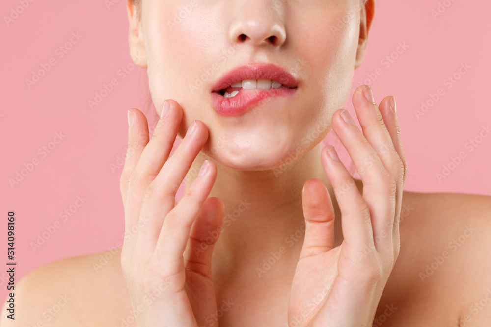 Close up cropped blonde half naked woman 20s perfect skin lips nude make up isolated on pastel pink wall background studio portrait. Skin care healthcare cosmetic procedures concept Mock up copy space Close up cropped blonde half naked woman 20s perfect skin lips nude make up isolated on pastel pink wall background studio portrait. Skin care healthcare cosmetic procedures concept Mock up copy space