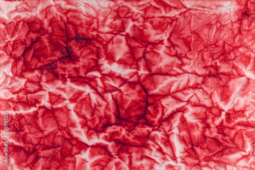Old crumpled shabby red paper. Paper surface texture.