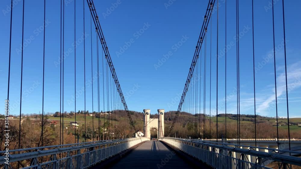 Reveal shot of Pont Charles Albert suspension bridge in Cruseilles, France Reveal shot of Pont Charles Albert suspension bridge in Cruseilles, France