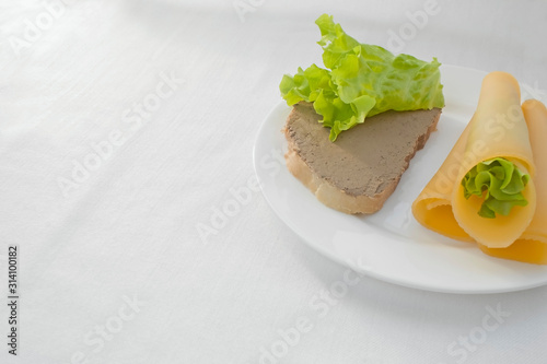 a sandwich with chicken pate and lettuce