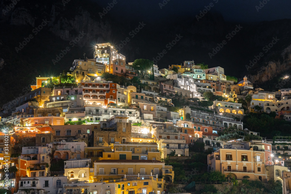 Colorful houses of Positano along Amalfi coast at night, Italy. Night landscape.