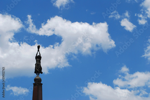 statue of liberty against blue sky