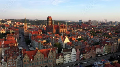 Gdansk, Poland. Aerial 4K reveal video of old city, Motlawa river and famous monuments: Gothic St Mary church, city hall tower, photo