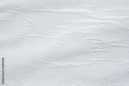 Blank white crumpled creased torn paper poster texture surface background © Piman Khrutmuang