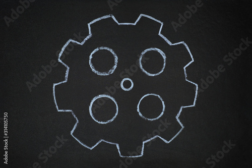 gear wheels illustration on blackboard