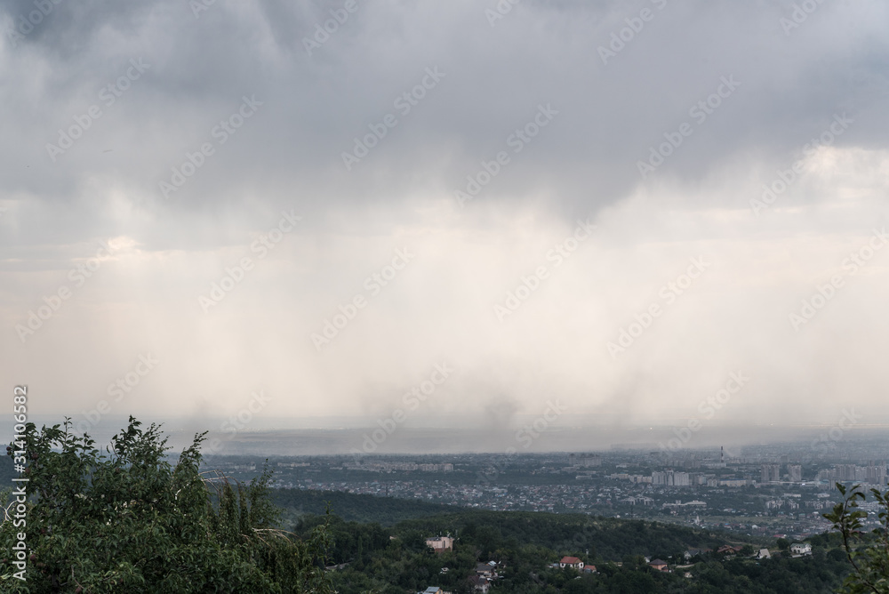 Heavy rain with the wind over the city of Almaty, Kazakhstan