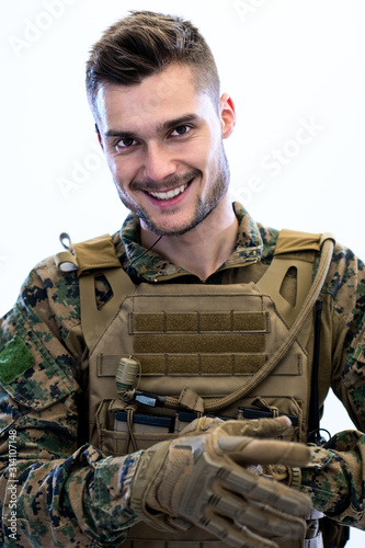 closeup of soldier hands putting protective battle gloves