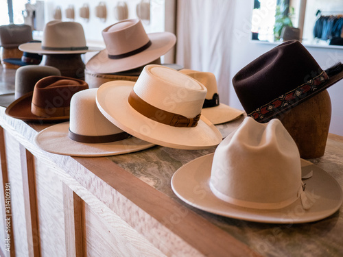 Fashionable hat display in retail store photo