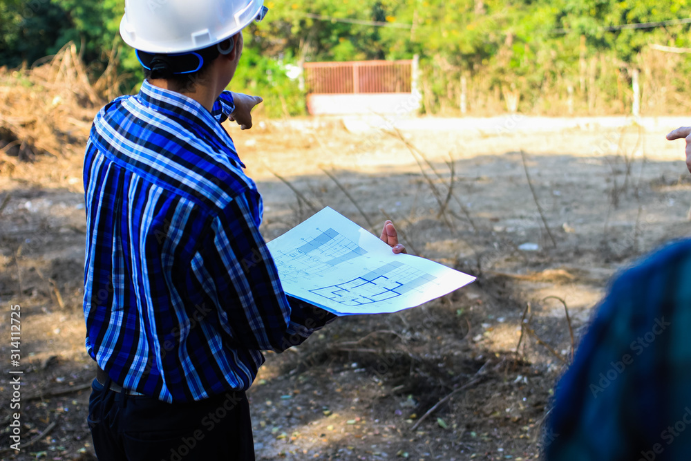 engineering team is discussing the location of the city housing project. engineering team is discussing the location of the city housing project.