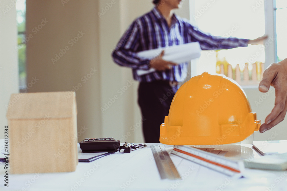 Team Engineers are writing solar panel for home construction designs to bring them to prospective customers.concept Team Engineers are writing solar panel for home construction designs to bring them to prospective customers.concept