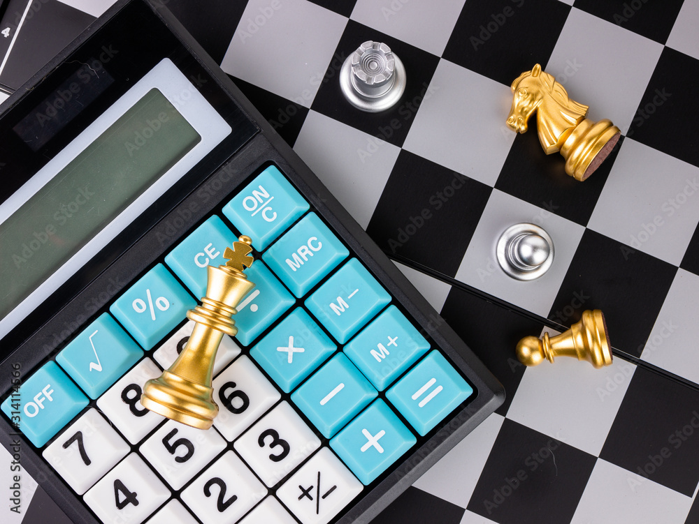 Financial games concept, Game of chess with calculator, selective focus.  Stock Photo | Adobe Stock