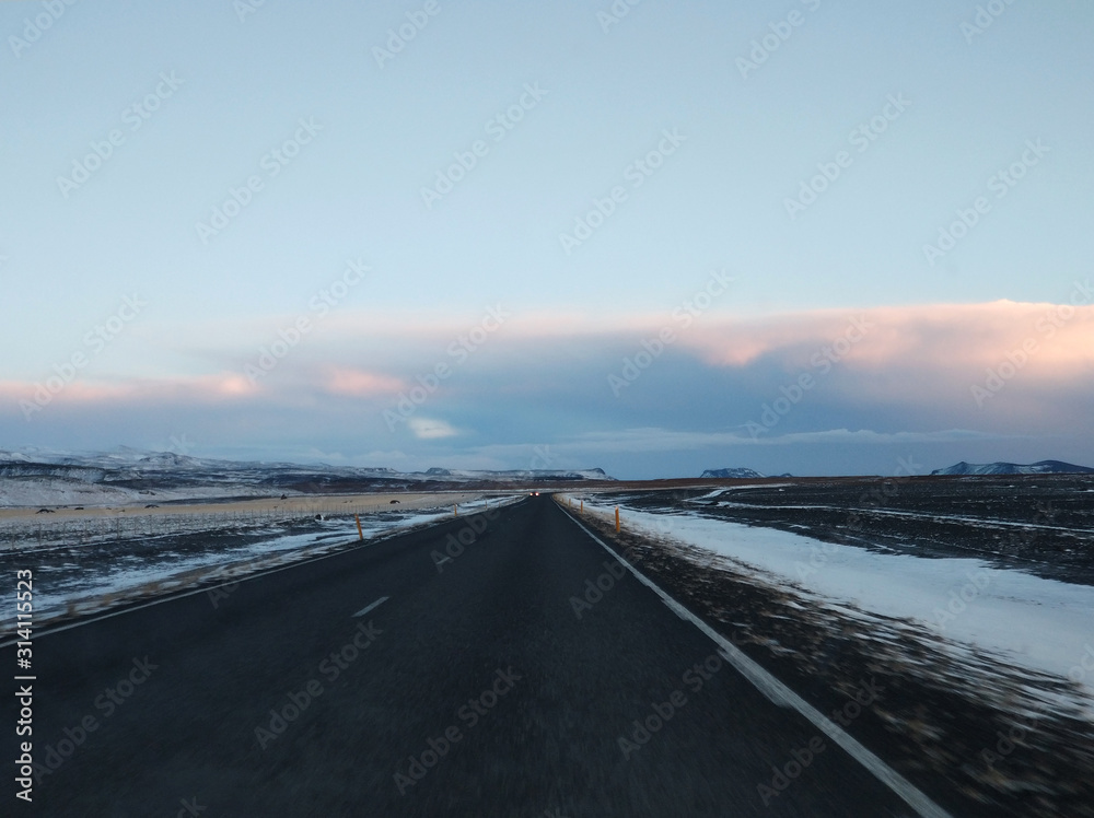 Picturesque winter landscape of Iceland. The perfect road to perspective Picturesque winter landscape of Iceland. The perfect road to perspective