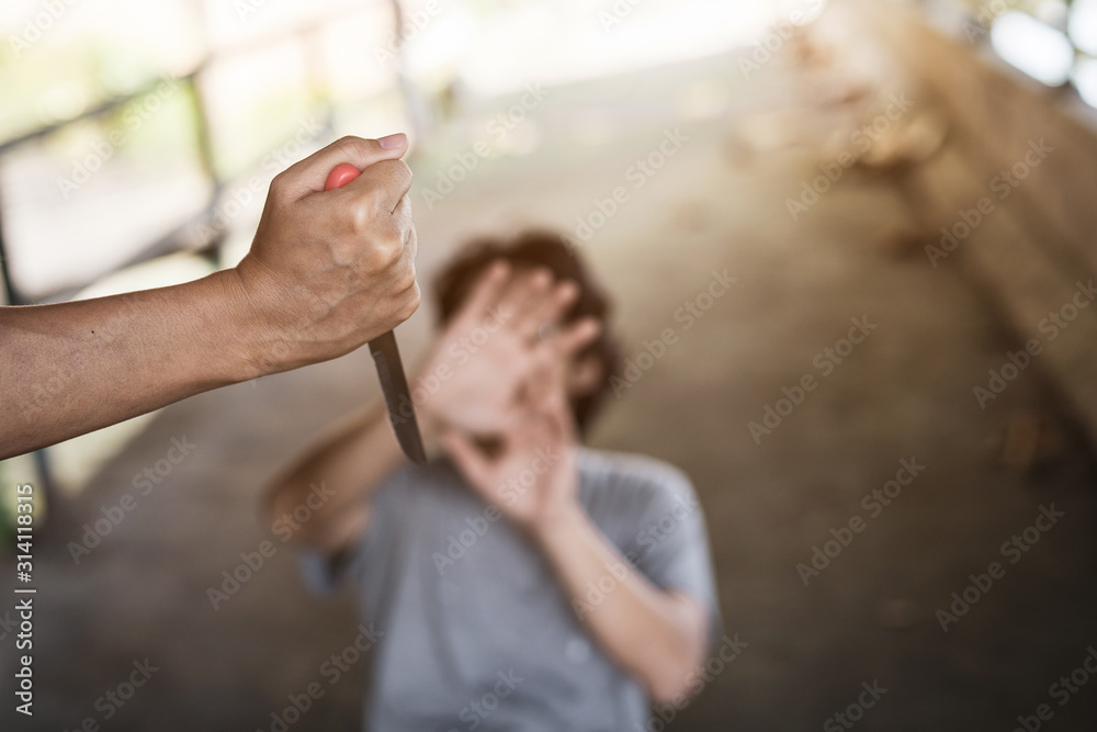 The image of a man being attacked by a knife using his knife.