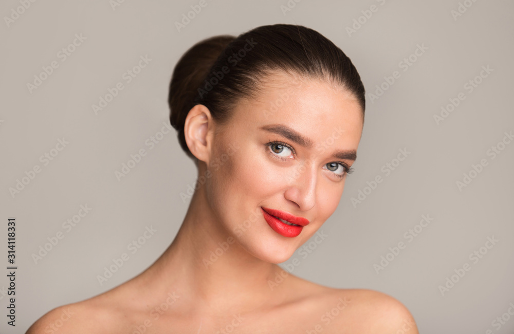 Young woman with perfect red lips smiling to camera Young woman with perfect red lips smiling to camera