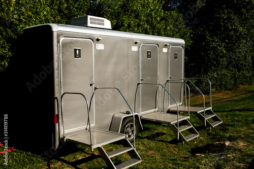 clean and upscale portable bathrooms at outdoor event photo