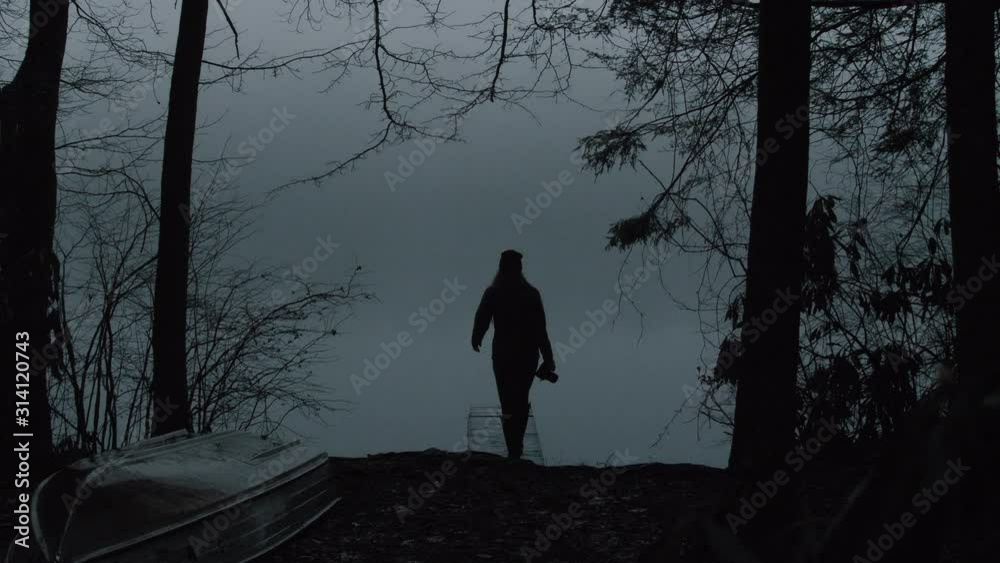Woman Walking out on Foggy Pond Dock