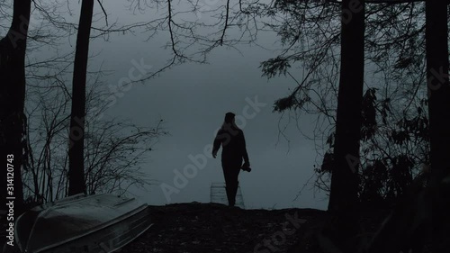 Woman Walking out on Foggy Pond Dock