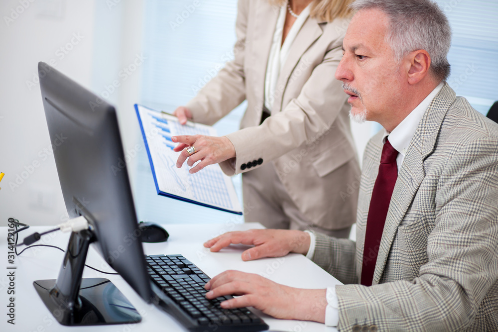 Business people at work in a bright office Business people at work in a bright office