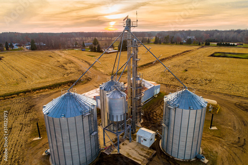 Canvas Print Aerial of Midwestern Farm including silos at dusk