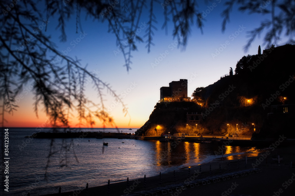 Evening seaside view. The beautiful village of the Cinque Terre, Monterosso al mare, in the blue hour. La Spezia, Liguria, Italy