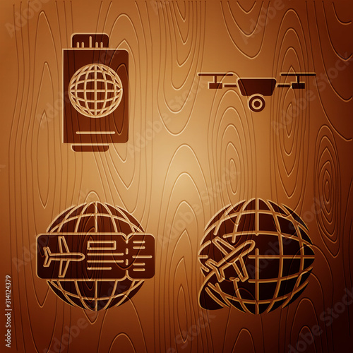 Set Globe with flying plane, Passport with ticket, Airline ticket and Drone flying with action video camera on wooden background. Vector