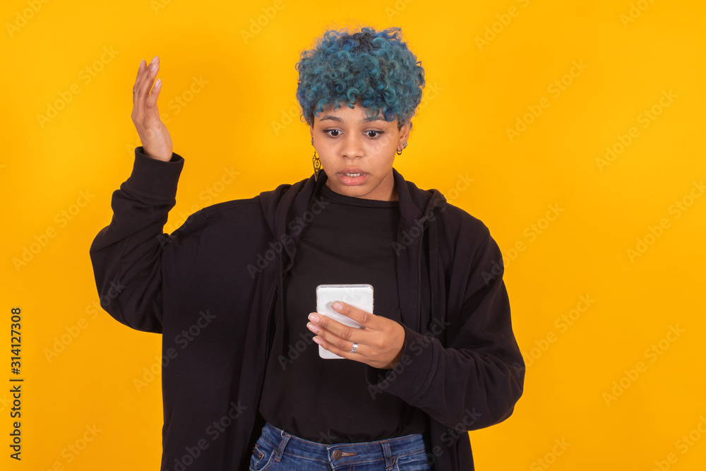 young woman or girl with mobile phone isolated on color background young woman or girl with mobile phone isolated on color background