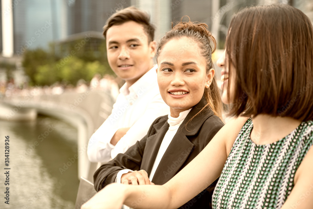 Happy friends smiling outdoor enjoying the city view Happy friends smiling outdoor enjoying the city view