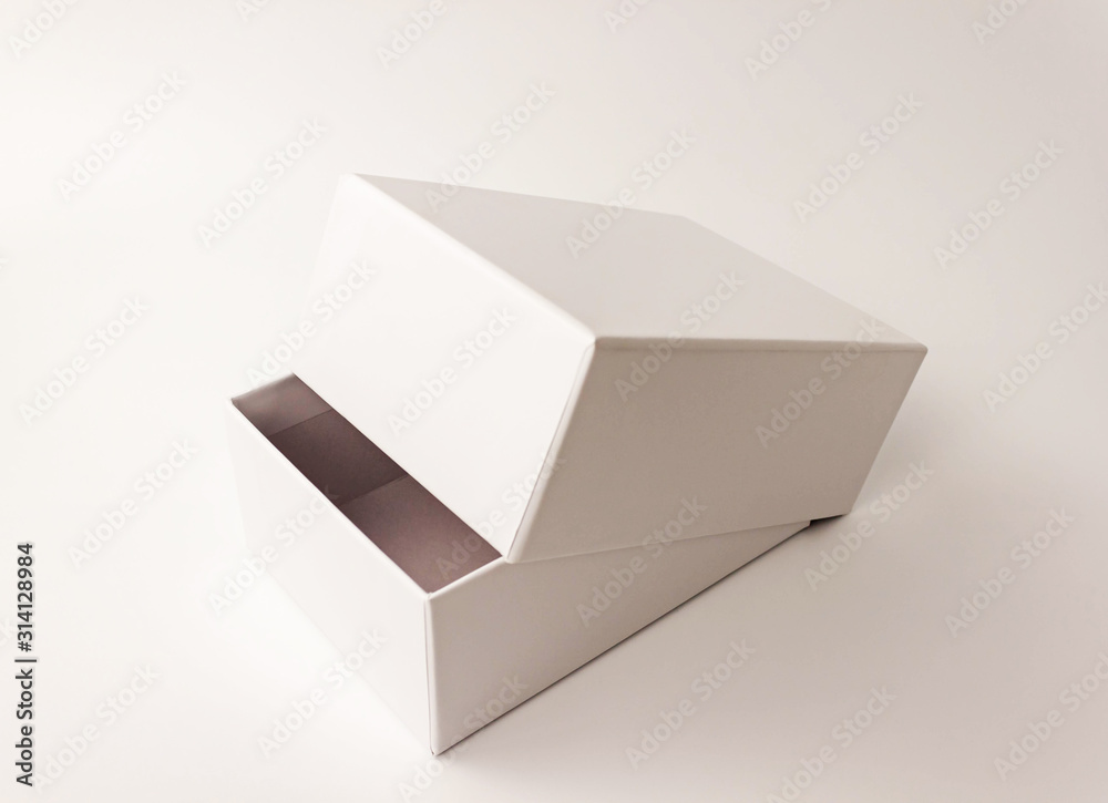 Single white paper box on light background. Packing, transportation, moving, present concept Single white paper box on light background. Packing, transportation, moving, present concept